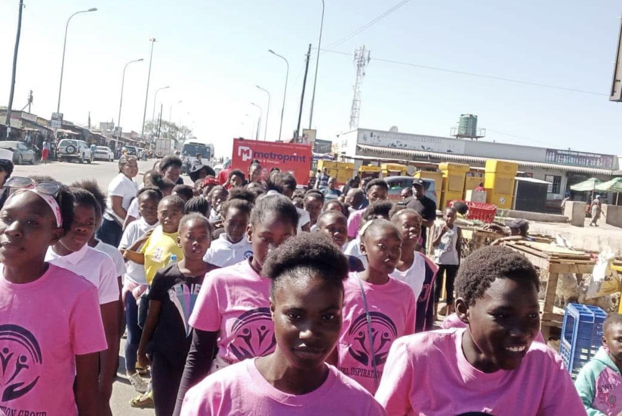 GIG girls marching in pink t-shirts