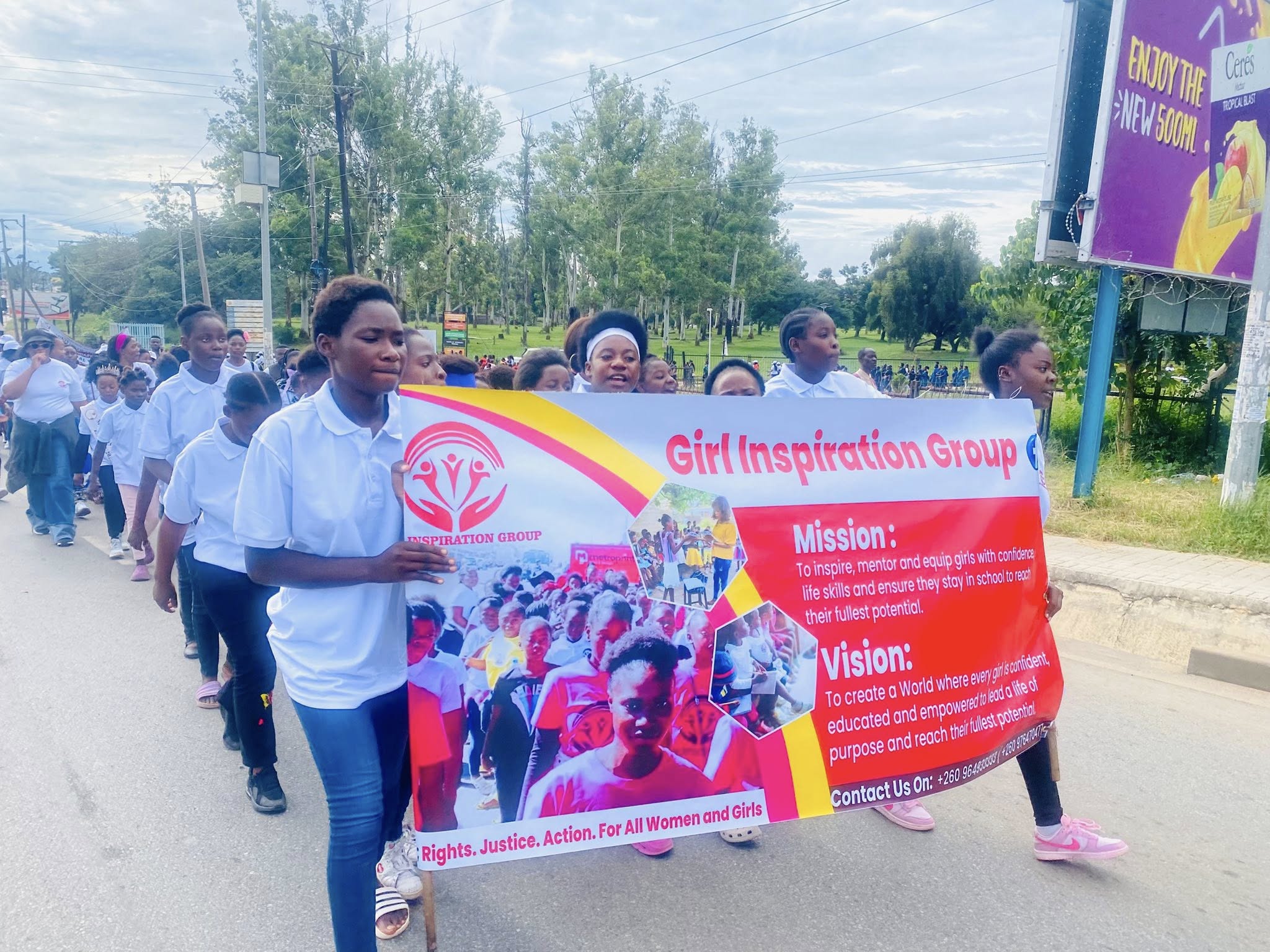 GIG girls marching with their banner