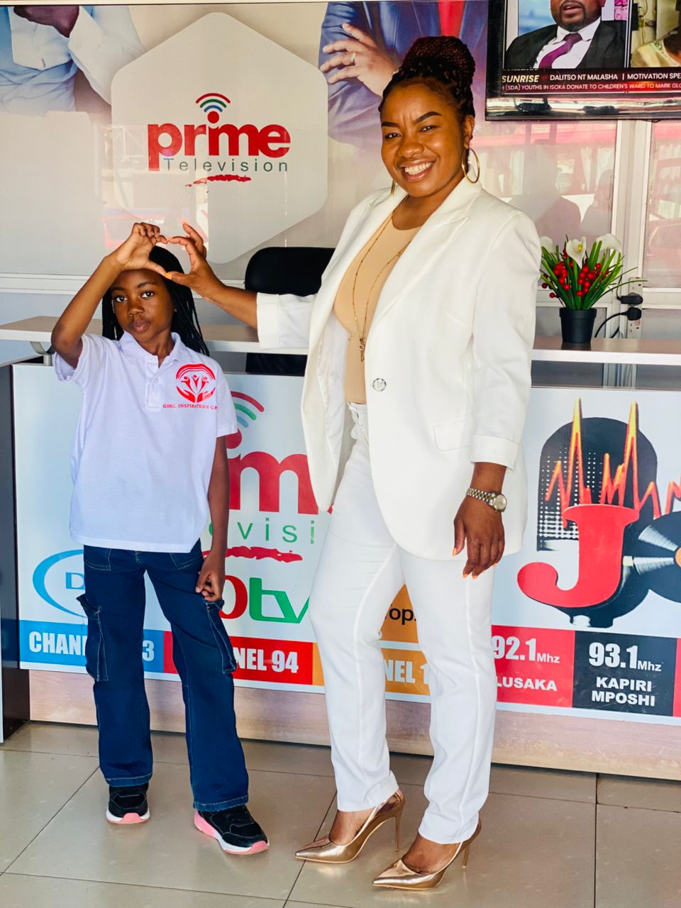 GIG representative and child at Prime TV